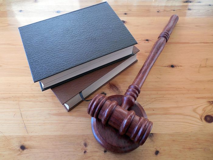 A law book and gavel representing legal terms
